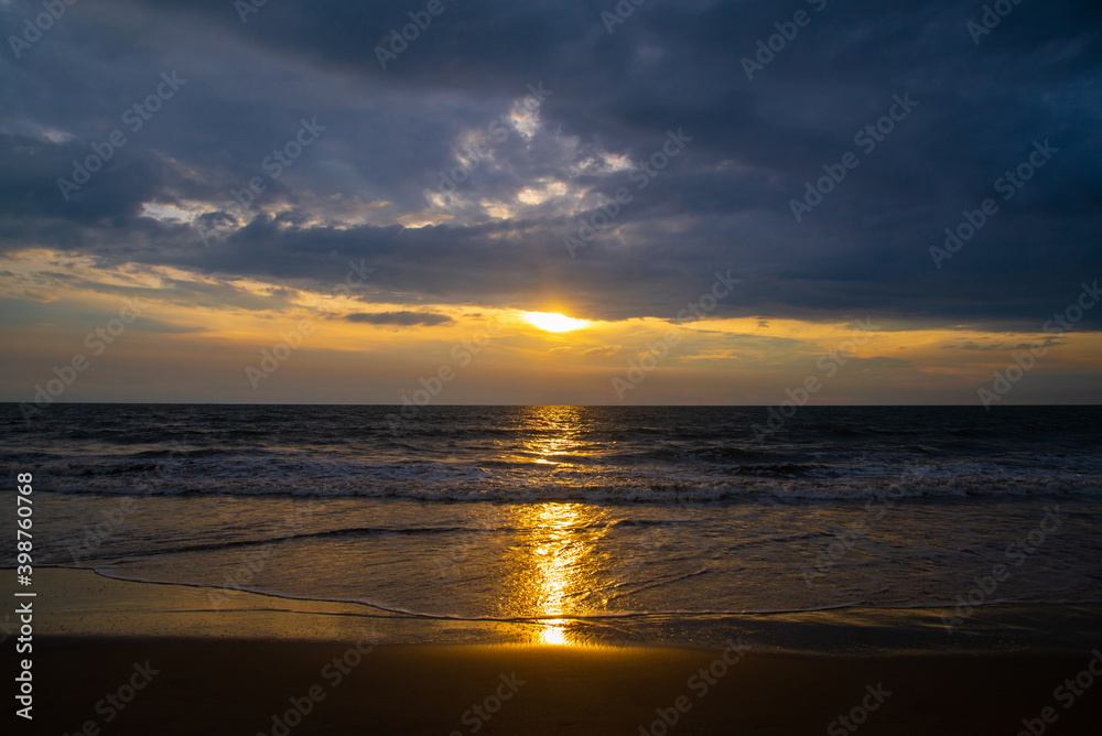 Colorful ocean beach sunset with deep blue sky, high quality image