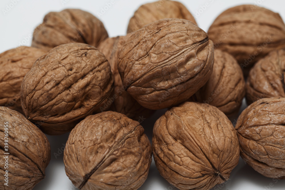 A scattering of walnuts in close-up A scattering of walnuts in close-up
