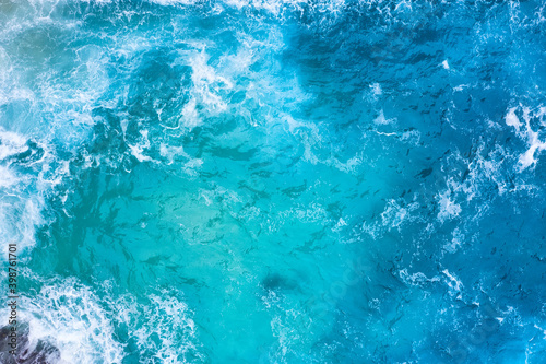 Ocean waves as a background. Blue water background from top view. Seacape from drone. Bali, Indonesia. Travel image