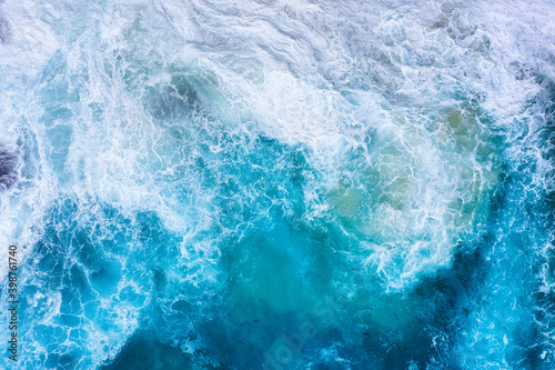 Ocean waves as a background. Blue water background from top view. Seacape from drone. Bali, Indonesia. Travel image