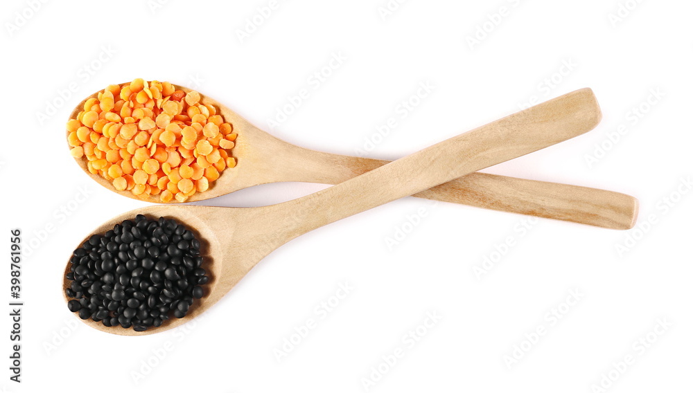 Red and black beluga lentils in wooden spoon isolated on white background, top view Red and black beluga lentils in wooden spoon isolated on white background, top view