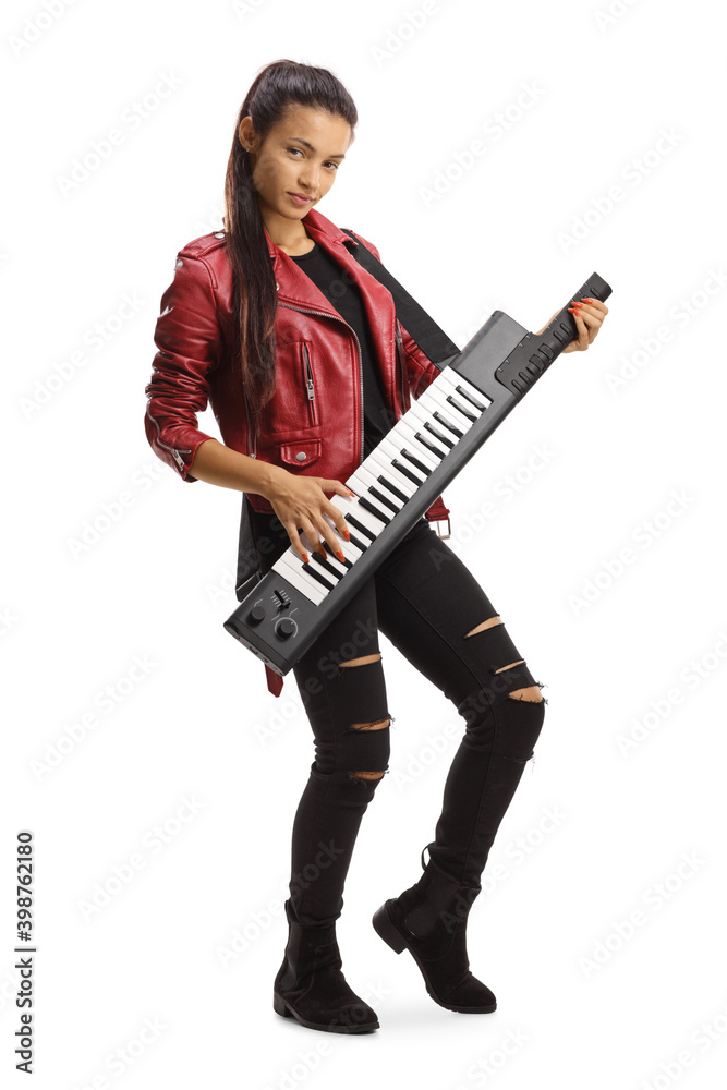 Young female in a leather jacket playing a keytar and looking at camera Young female in a leather jacket playing a keytar and looking at camera