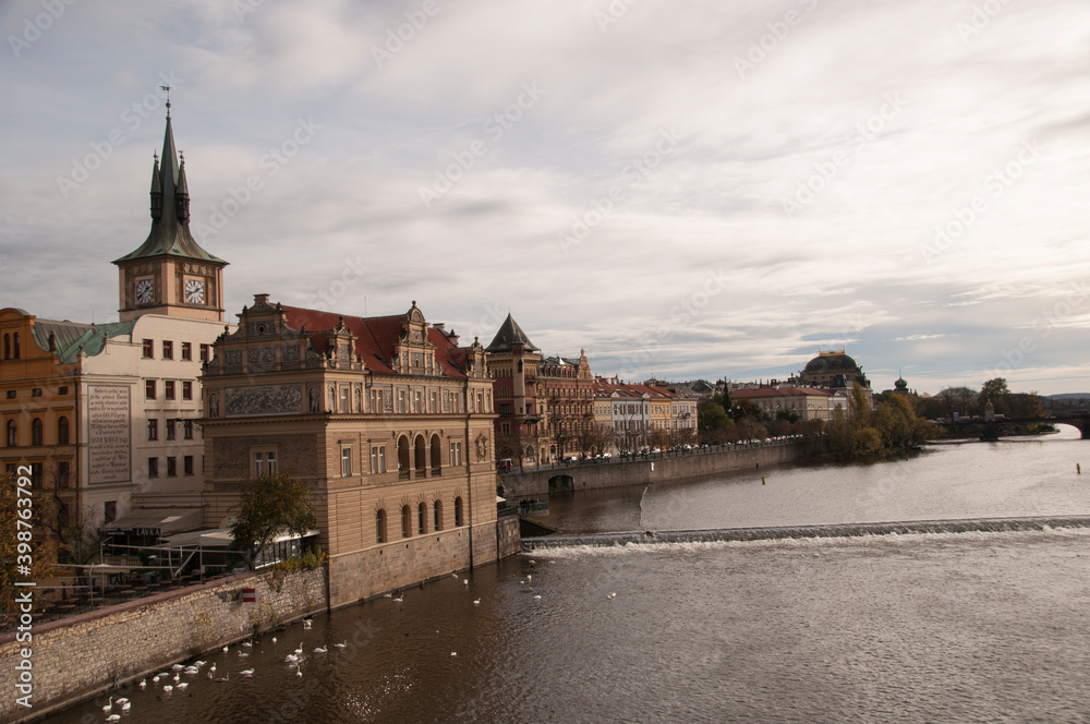 Panorama of the Vltava river. Roll on the river. Buildings along the river.
