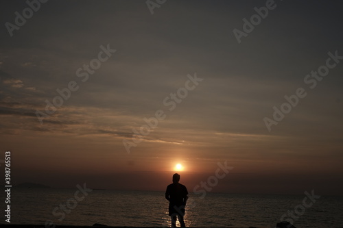 sunset and silhouette of a person 