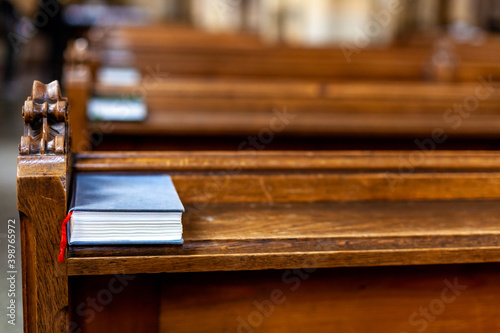 bible on an empty pew in a church before a service