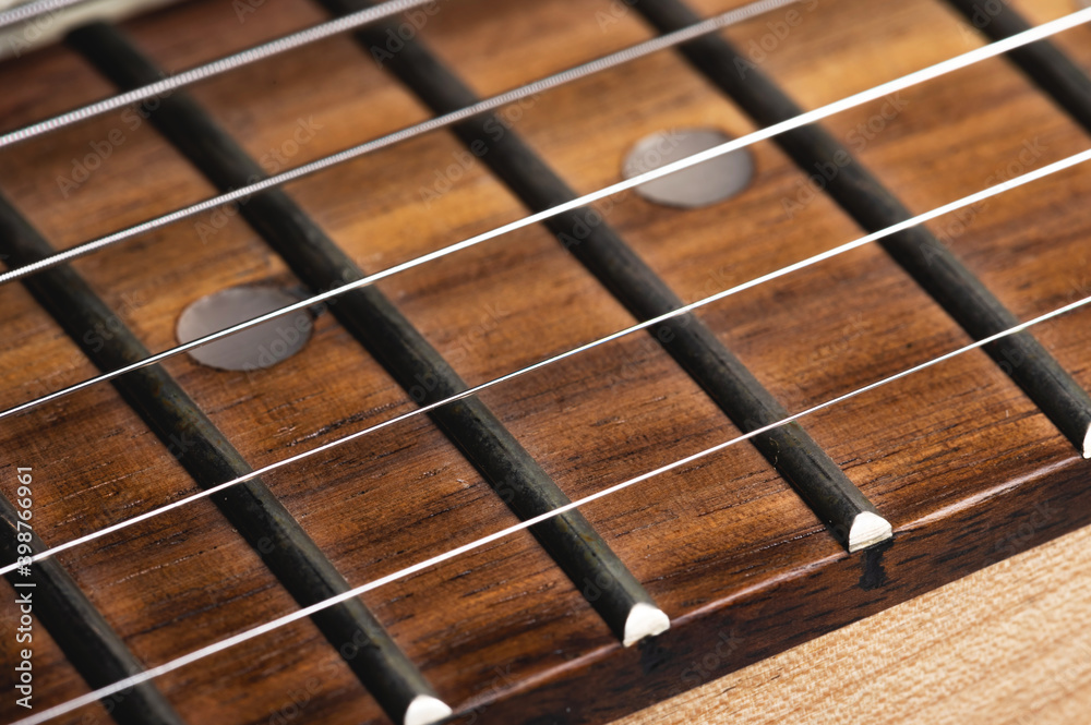 Electric guitar strings close-up. Music macro background Electric guitar strings close-up. Music macro background