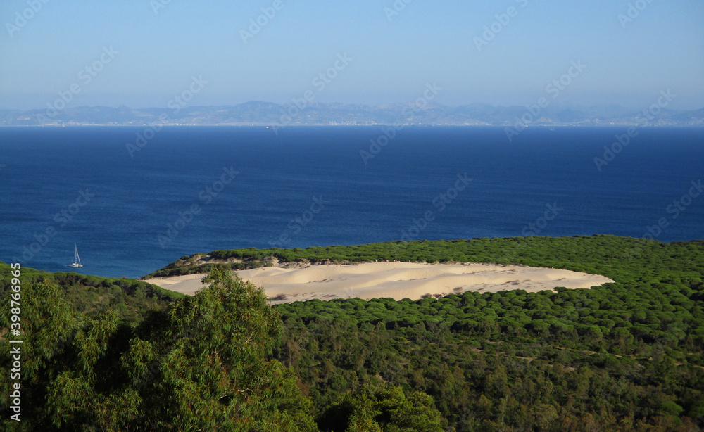 Large sand tongue of the dune of the beach of bolonia and view in the rear of Africa and the city of Tanger. Coast of Tarifa. Spain. Large sand tongue of the dune of the beach of bolonia and view in the rear of Africa and the city of Tanger. Coast of Tarifa. Spain.