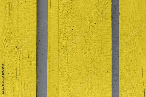 Yellow painted vertical planks wooden wall background. Creative wallpaper, website backdrop for design fence texture.