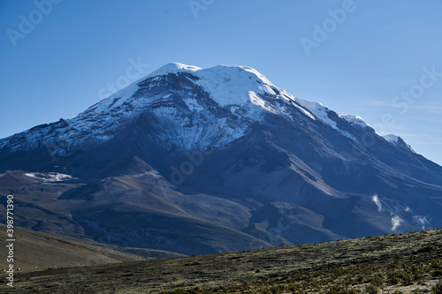 Snow capped Volcano Chimborazo is the highest mountain in Ecuador and the summit is the farthest point on the Earths surface from the planets center, because it is near the equator