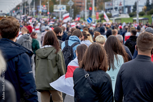 Protesters against the incumbent president of Belarus took to the streets of Minsk with flags.