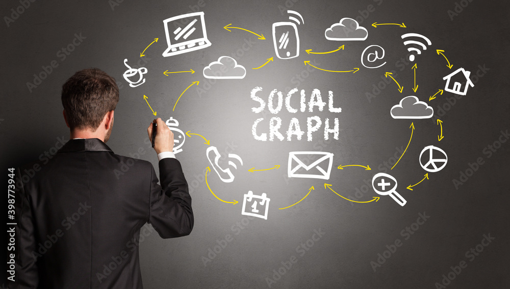 businessman drawing social media icons with SOCIAL GRAPH inscription, new media concept businessman drawing social media icons with SOCIAL GRAPH inscription, new media concept