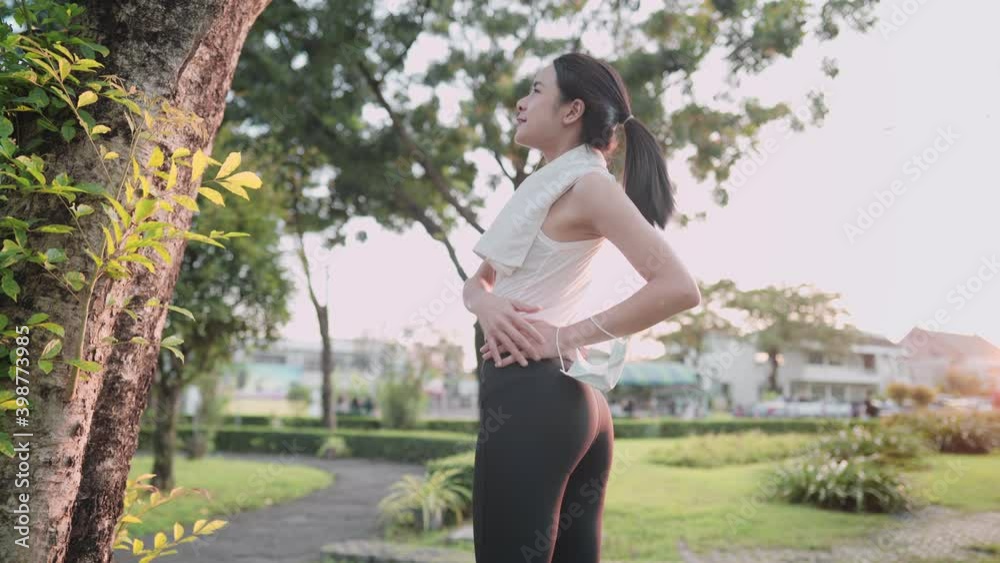 Asian fit young female stretching her waist
lower back, warm up before exercise, body flexibility, health care, standing under the trees inside recreational exercise park, fresh morning work out Asian fit young female stretching her waist
lower back, warm up before exercise, body flexibility, health care, standing under the trees inside recreational exercise park, fresh morning work out
