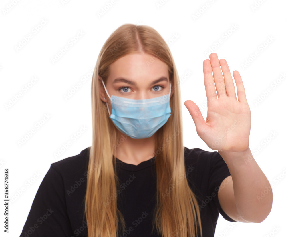 Girl wearing mask for protection from disease and show stop hands gesture for stop corona virus outbreak. Girl wearing mask for protection from disease and show stop hands gesture for stop corona virus outbreak.