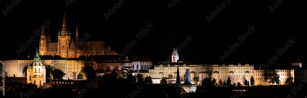Fototapeta premium .panorama of night prague illuminated charles bridge on river vltava and prague castle and saint vitus church in center of prague
