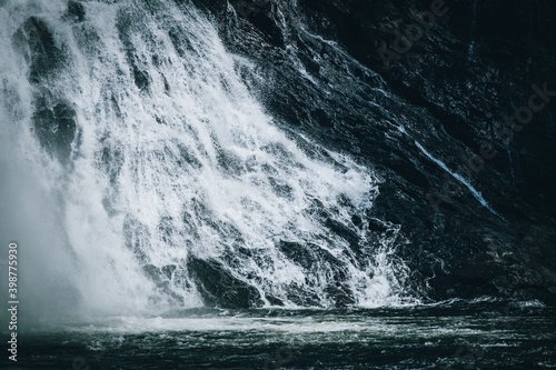 a large waterfall with a black background