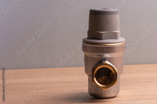 White coated bronze pressure relief valve for domestic water supply. Water reducer 1/2 inch adjustable.