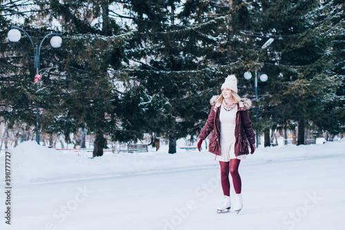 Beautiful girl having fun in winter park