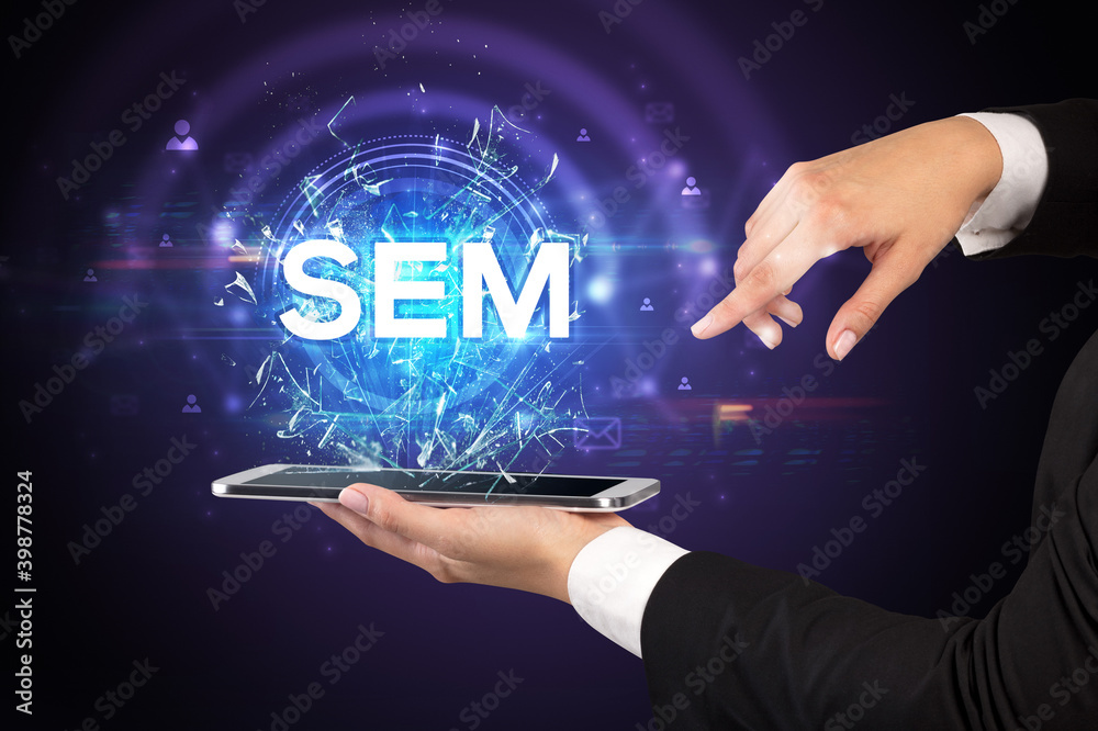 Close-up of a touchscreen with SEM abbreviation, modern technology concept Close-up of a touchscreen with SEM abbreviation, modern technology concept