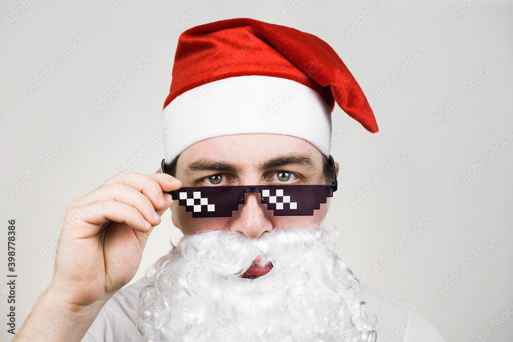 Swag Santa Claus in funny pixelated sunglasses on white background. Gangster, boss, thug life meme. 8bit style. Holly Jolly x Mas Noel. Cool grandfather. Party time, Happy New Year, Merry Christmas Swag Santa Claus in funny pixelated sunglasses on white background. Gangster, boss, thug life meme. 8bit style. Holly Jolly x Mas Noel. Cool grandfather. Party time, Happy New Year, Merry Christmas