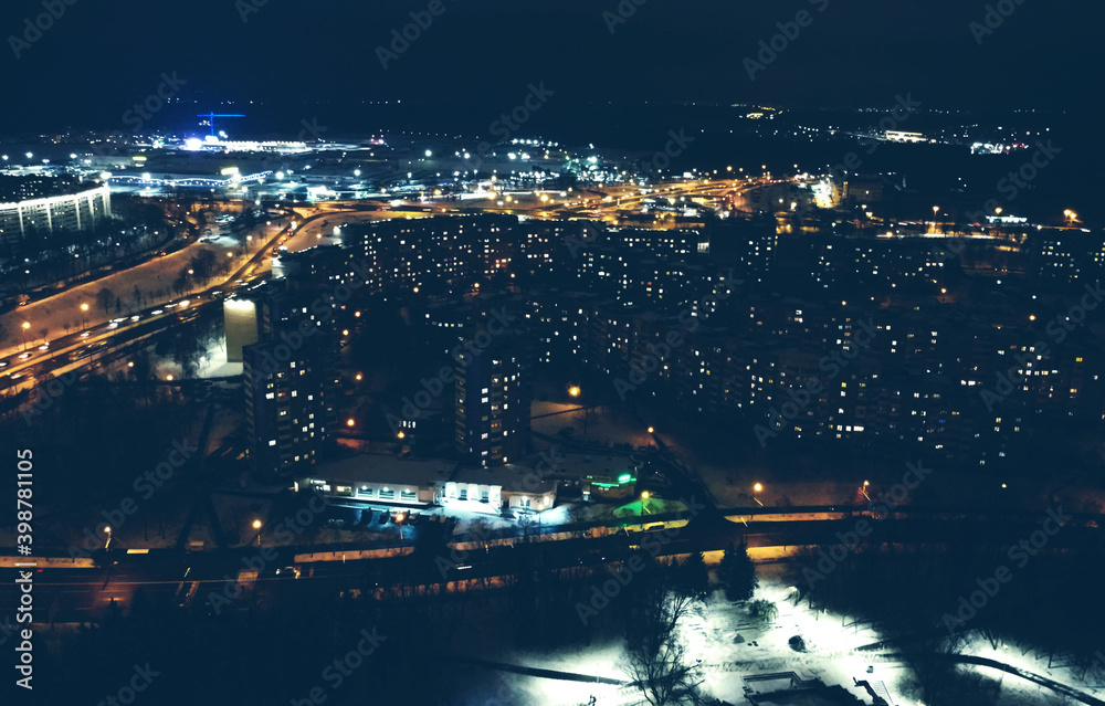 Top view of the night winter city with lights and lanterns Top view of the night winter city with lights and lanterns