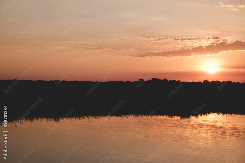 a sunset over a lake