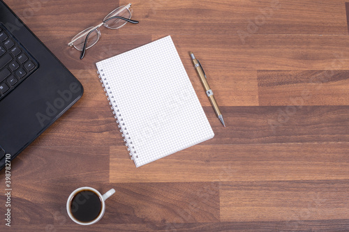 cup of coffee on office desk Top view with copy space  flat lay.