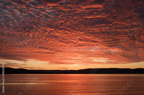 a sunset over a body of water