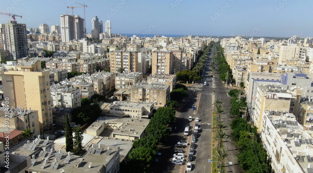 Netanya, Israel from a bird's eye view. Top-down view of the city during the Yom Kippur holiday, when all highways and roads are empty. Cars are not allowed to drive on this day