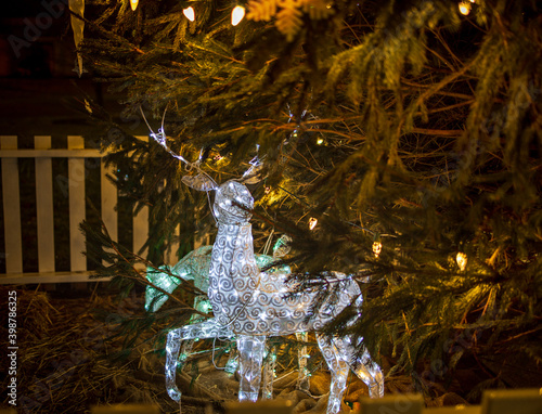 Pair of Reindeer outdoor Christmas light decorations by Christmas Tree