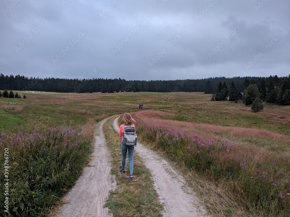 woman hiking through the south bohemia national park during spring season