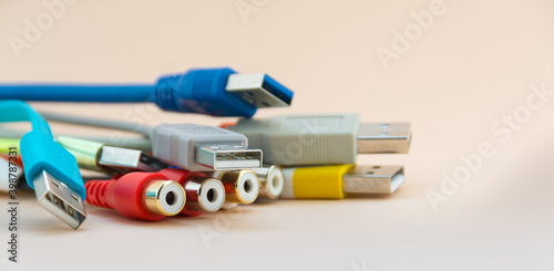 Multicolored wire and cable used in communication internet cable network and computer system on light background.