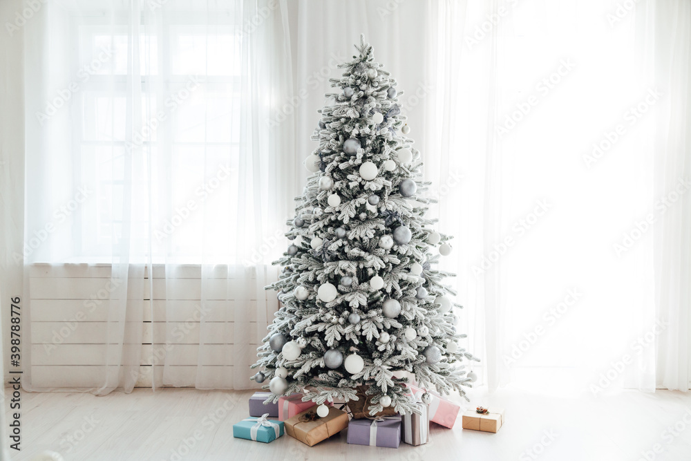 snow Christmas tree with gifts for the new year interior decor