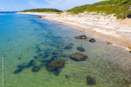 shore of island with focus on underwater rocks