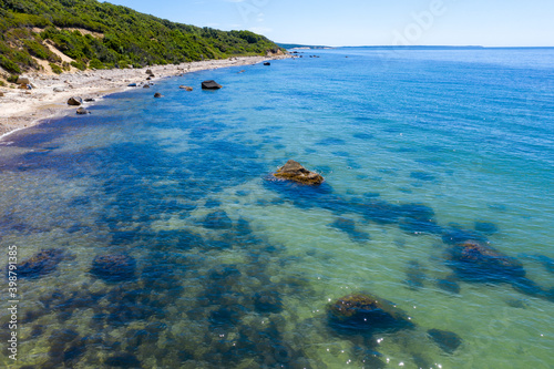 shoreline near cliffs and beach