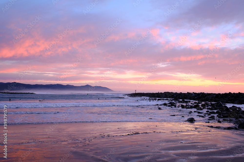 Fototapeta premium Sunset surf warning, mega waves, beautiful sky, pure power. 