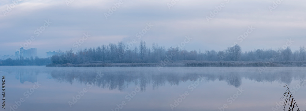 Ukraine, Kyiv - 30 November 2020: Nebrezh Lake at the frozen mist morning weather Ukraine, Kyiv - 30 November 2020: Nebrezh Lake at the frozen mist morning weather