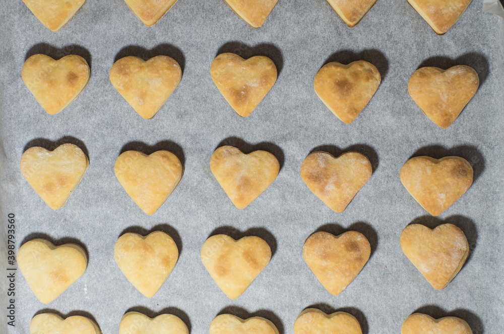 Homemade sweet cookies in the shape of hearts. Home comfort in the kitchen. Cooking with love Homemade sweet cookies in the shape of hearts. Home comfort in the kitchen. Cooking with love