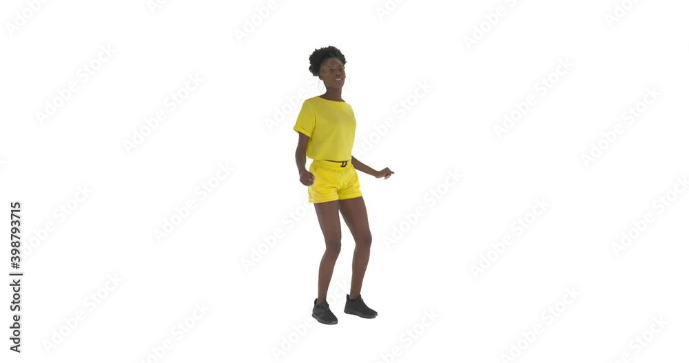 Young African woman dancing freestyle. Dancer turning around and shaking body. Street dance concept. Isolated on white background Young African woman dancing freestyle. Dancer turning around and shaking body. Street dance concept. Isolated on white background