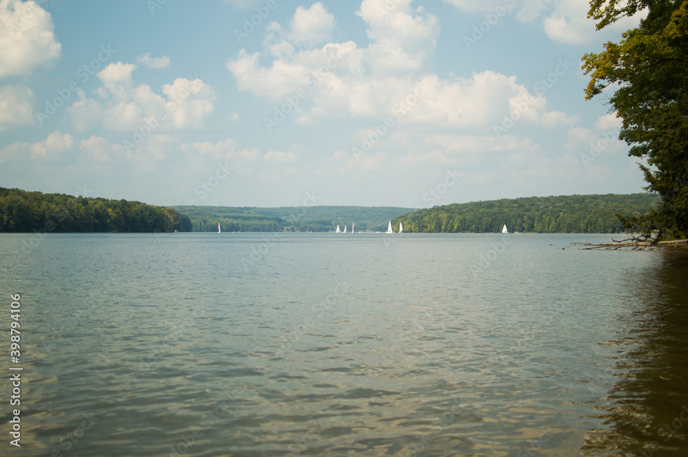 Glendale lake is graced by sailboats and a blue sky Glendale lake is graced by sailboats and a blue sky