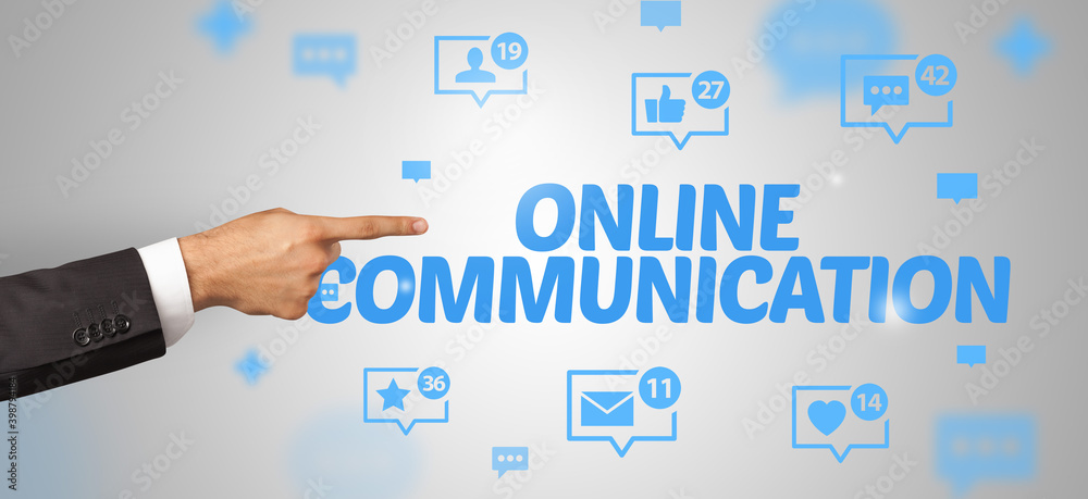 Close-Up of cropped hand pointing at ONLINE COMMUNICATION inscription, social networking concept Close-Up of cropped hand pointing at ONLINE COMMUNICATION inscription, social networking concept