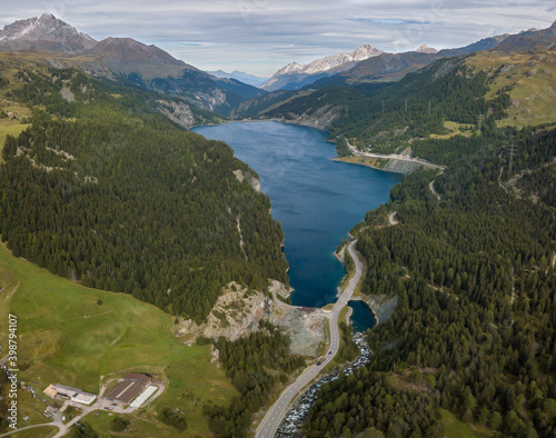 road that runs alongside the lake of marmore in a swiss valley