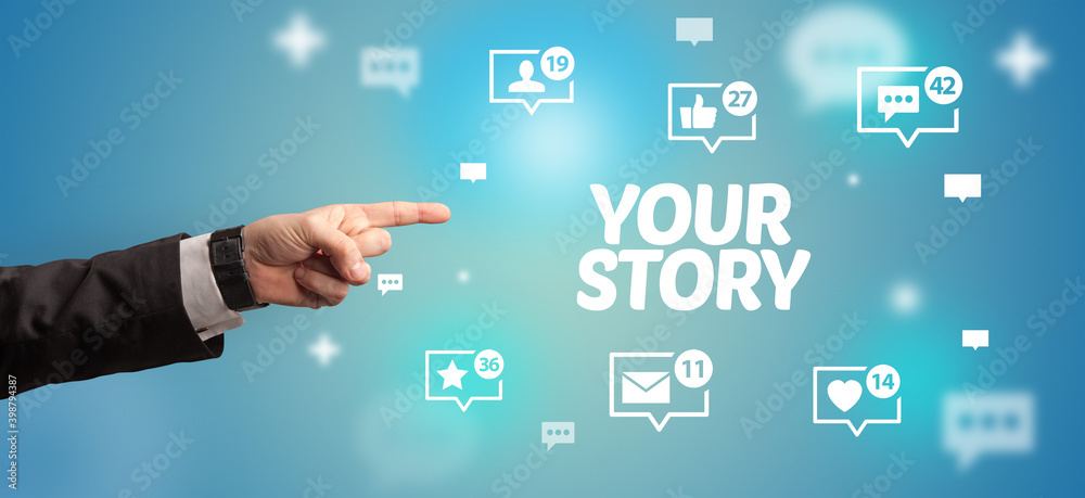 Close-Up of cropped hand pointing at YOUR STORY inscription, social networking concept Close-Up of cropped hand pointing at YOUR STORY inscription, social networking concept