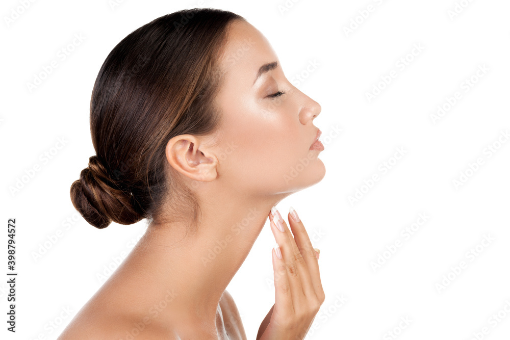 Pretty woman touching her neck, isolated on white background Pretty woman touching her neck, isolated on white background