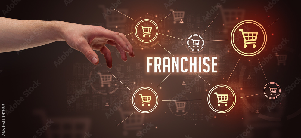 Close-Up of cropped hand pointing at FRANCHISE inscription, online shopping concept