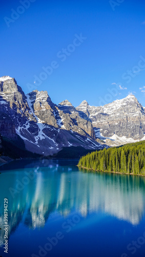 Reflection of glacier mountains and forest in Moraine Lake - Twenty Dollar bill view © lisa