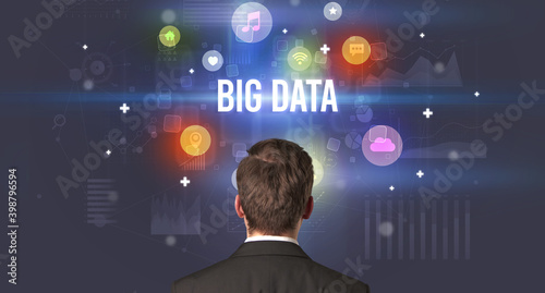 Rear view of a businessman with BIG DATA inscription, modern technology concept