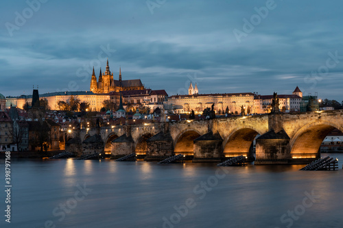 Prague Castle and St. Vitus Cathedral and Charles Bridge on the Vltava River and on the banks © svetjekolem