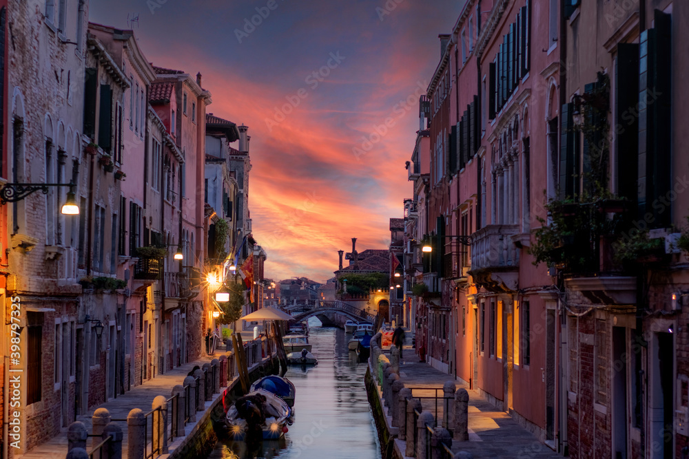 Fototapeta premium typical Venetian alley called calle at sunset without anyone because of the covid 19