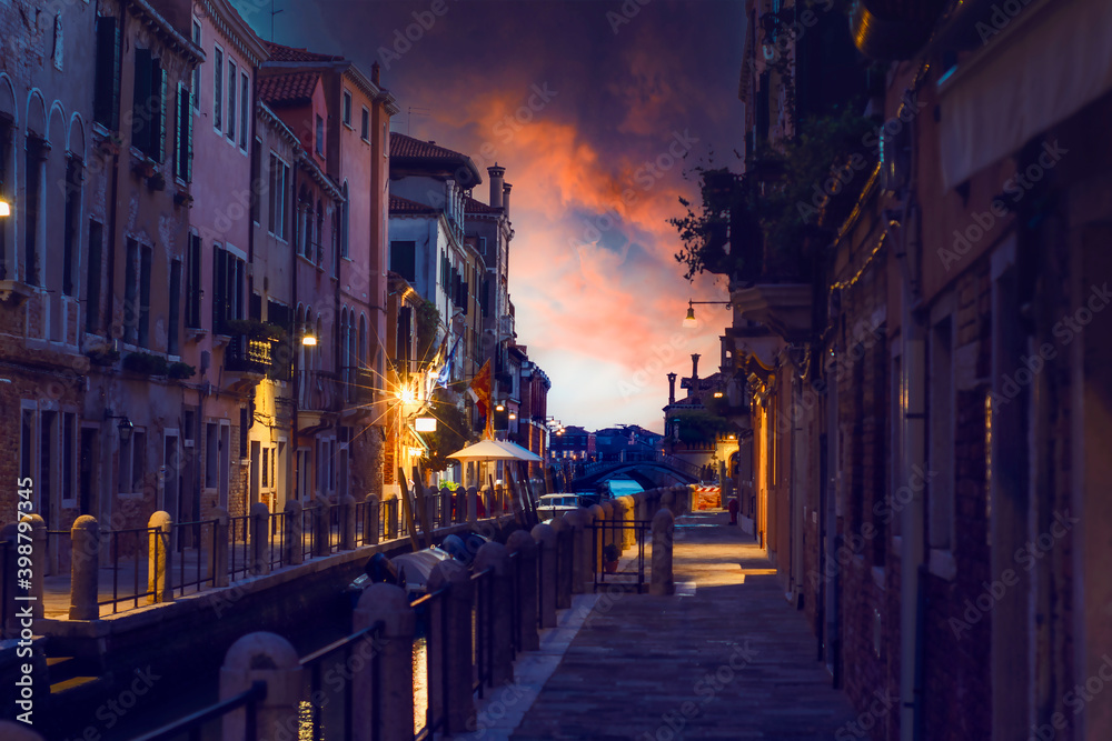 typical Venetian alley called calle at sunset without anyone because of the covid 19 typical Venetian alley called calle at sunset without anyone because of the covid 19