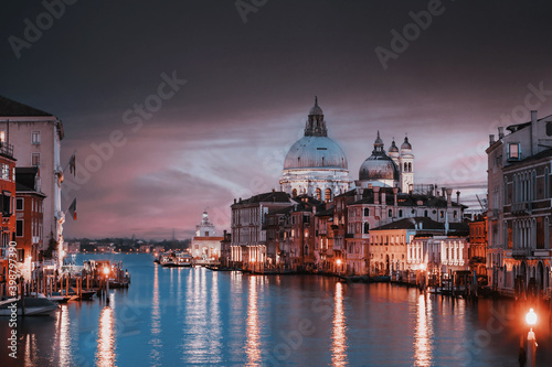 view of the Canal Grand and Basilica of Santa Maria della Salute from the Accademia bridge during covid 19 at sunset  © Emanuele